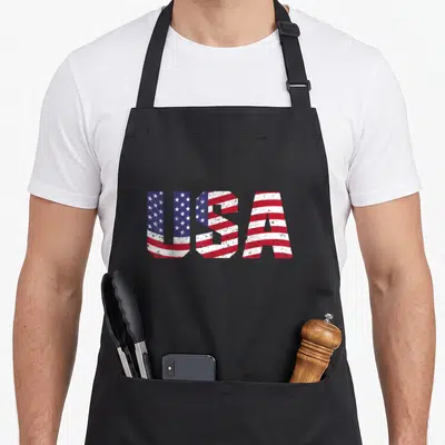 Tablier de cuisine noir avec linscription USA remplie par le drapeau américain vintage rouge blanc et bleu.