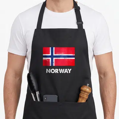 Tablier de cuisine noir avec le drapeau de la Norvège et le mot NORWAY en blanc.