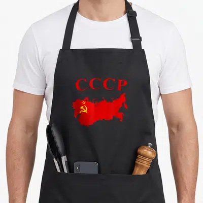 Tablier de cuisine noir avec CCCP rouge et carte URSS rouge ornée d'un marteau et d'une faucille jaunes.