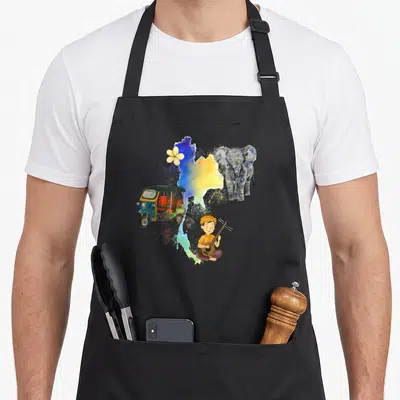 Tablier de cuisine noir avec illustration d'un tuk-tuk, d'un éléphant et d'un musicien sur une carte colorée.