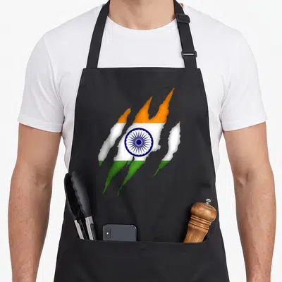 Tablier de cuisine noir avec drapeau de l'Inde stylisé en marques de griffure colorées.