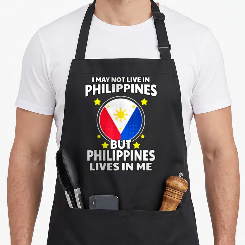 Tablier de cuisine noir avec le drapeau des Philippines et texte blanc entouré d'étoiles jaunes.