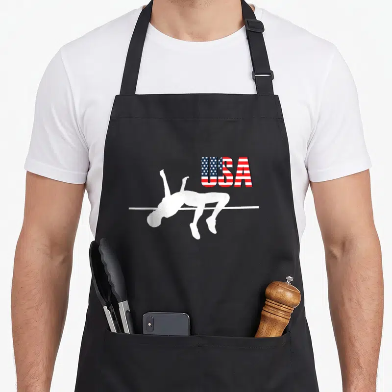 Tablier de cuisine noir avec silhouette blanche de sauteur et texte USA motif drapeau américain