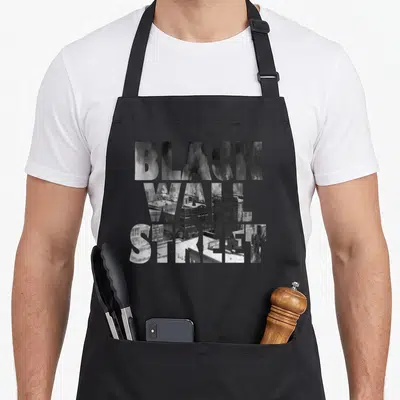 Tablier de cuisine noir avec typographie Black Wall Street intégrant une photographie historique des bâtiments de Greenwood.