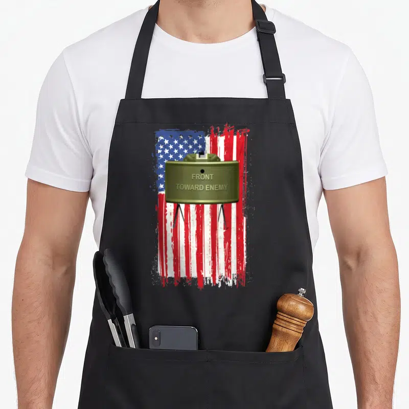 Tablier de cuisine noir avec illustration drapeau américain et mine Claymore olive vert.