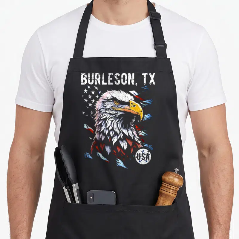 Tablier de cuisine noir avec tête d'aigle américaine et inscription Burleson TX style vintage déstructuré.