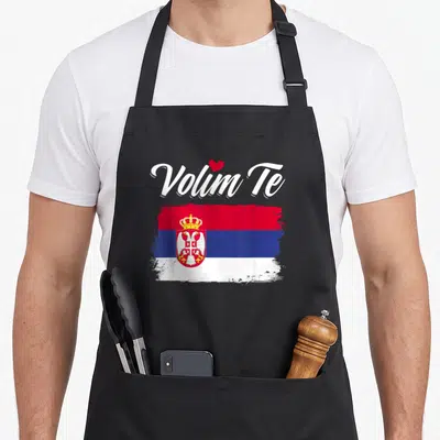 Tablier de cuisine noir avec inscription Volim Te et drapeau Serbie aux couleurs vives sur fond uni.