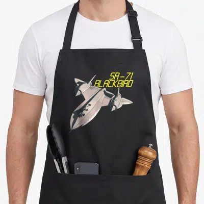 Tablier de cuisine noir avec illustration d'avion SR-71 Blackbird en vol stylisé