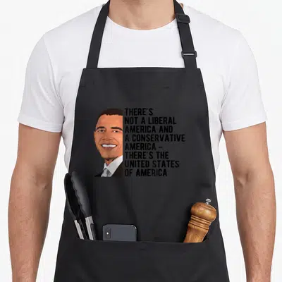 Tablier de cuisine noir avec portrait stylisé et texte blanc citant l'United States of America