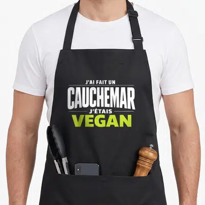Tablier de cuisine noir avec l'inscription J'ai fait un cauchemar j'étais vegan en typographie blanche et verte.