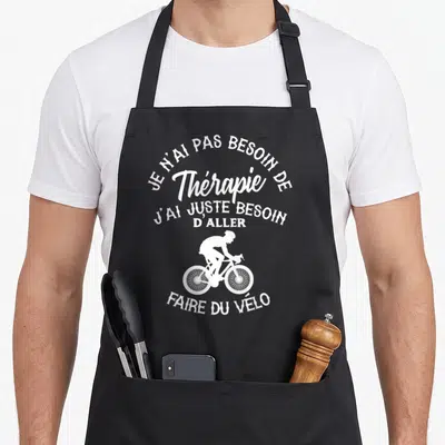 Tablier de cuisine noir avec inscription blanche sur le thème du cyclisme et d'un cycliste en silhouette.