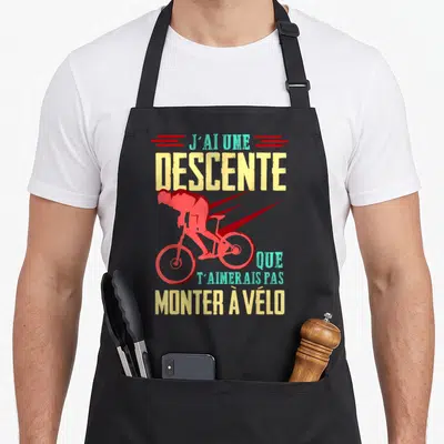 Tablier de cuisine noir avec silhouette cycliste rouge et texte J'ai une descente que t'aimerais pas monter à vélo.