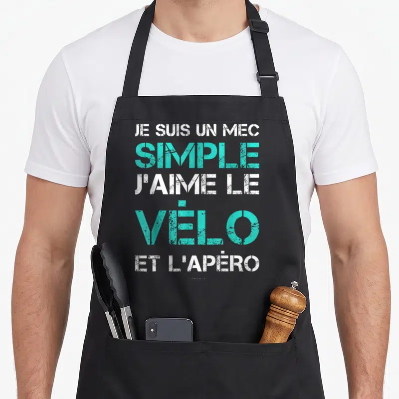 Tablier de cuisine noir avec inscription blanche et turquoise Je suis un mec simple j'aime le vélo et l'apéro en typographie usée.
