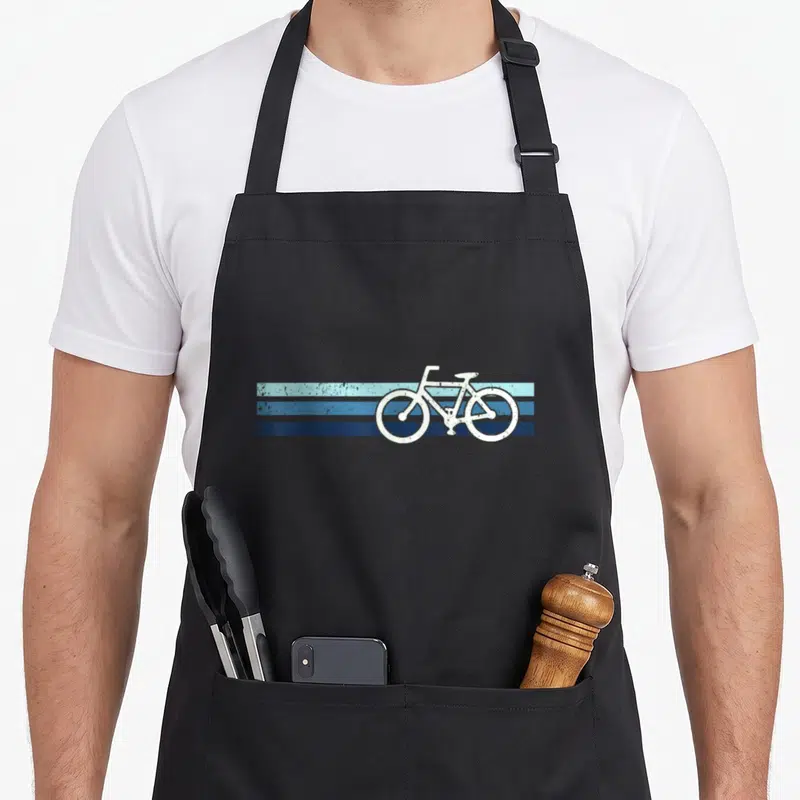 Tablier de cuisine noir avec illustration de vélo blanc sur bandes horizontales bleues texturées vintage