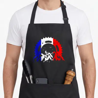 Tablier de cuisine noir avec illustration cycliste descente tricolore chaîne et montagnes bleue blanche rouge