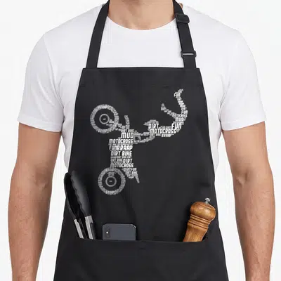 Tablier de cuisine noir avec une silhouette de moto formée par les mots Dirt Bike, Motocross, Fun et Braap en blanc.
