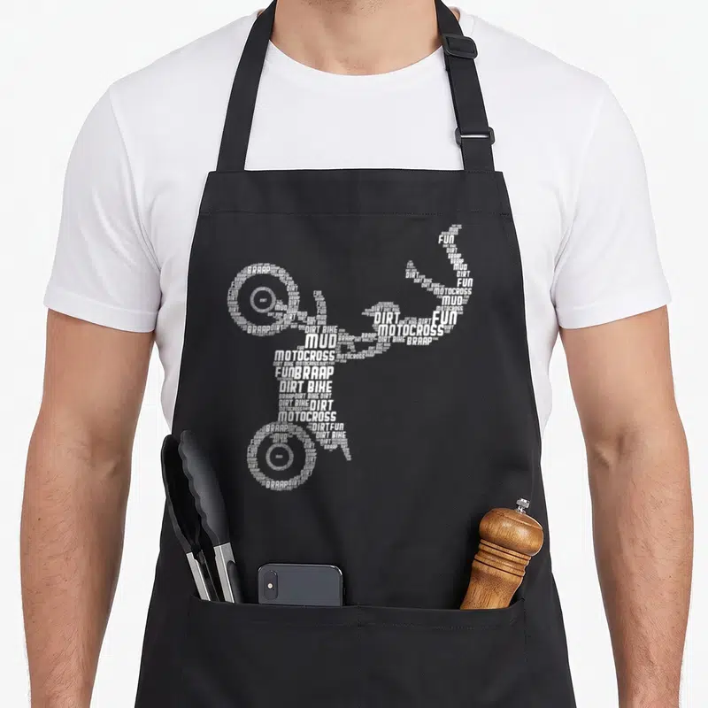 Tablier de cuisine noir avec une silhouette de moto formée par les mots Dirt Bike, Motocross, Fun et Braap en blanc.