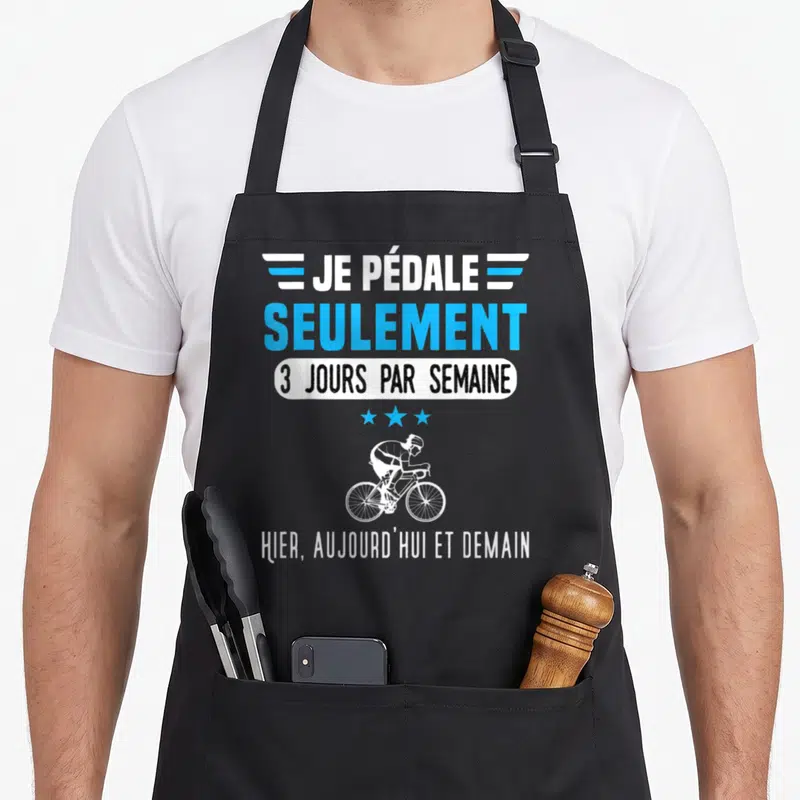 Tablier de cuisine noir avec illustration cycliste et texte Je pédale seulement 3 jours par semaine hier aujourd'hui et demain.