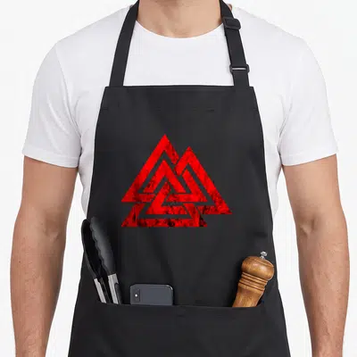 Tablier de cuisine noir avec le motif géométrique valknut rouge aux contours usés.