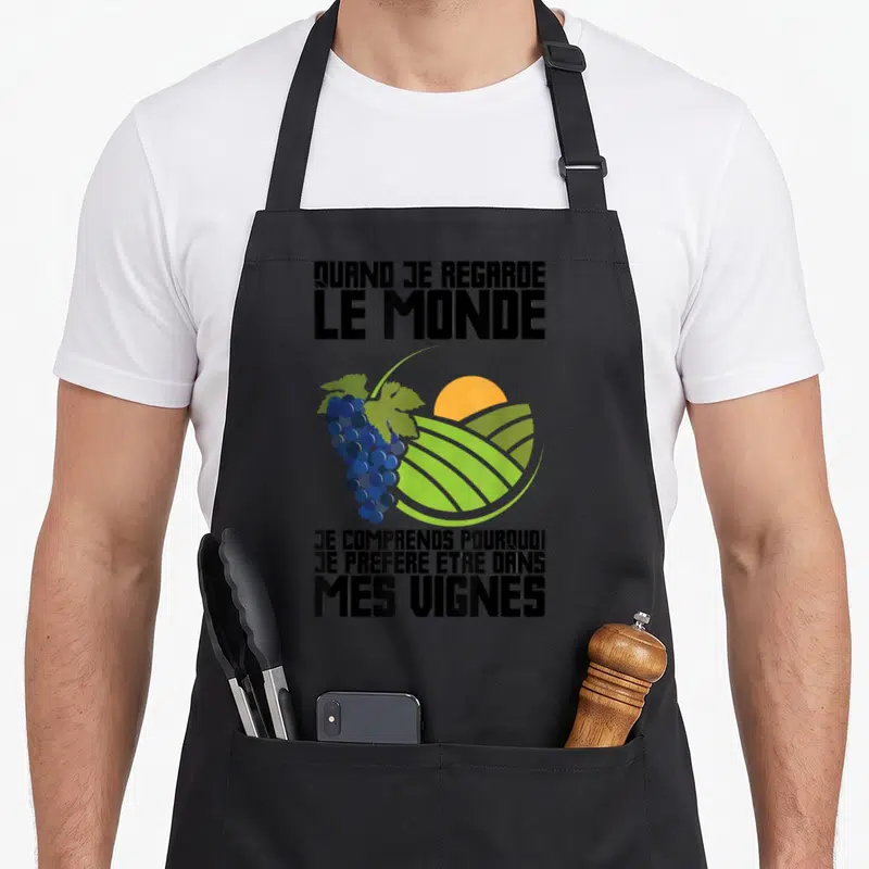Tablier de cuisine noir avec illustration de raisin, soleil et texte Quand je regarde le monde je prefere etre dans mes vignes.
