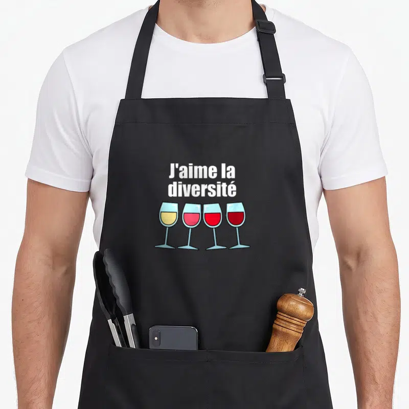 Tablier de cuisine noir avec quatre verres à vin colorés et texte blanc J'aime la diversité