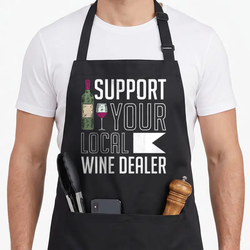 Tablier de cuisine noir avec texte Supportez votre marchand de vin local et illustration de bouteille verte.