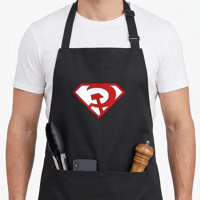 Tablier de cuisine noir avec un logo rouge et blanc inspiré de Superman et du marteau et faucille.