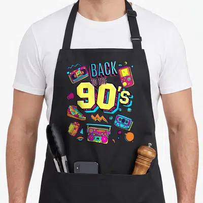 Tablier de cuisine noir avec illustration colorée Back to the 90's et objets rétro.