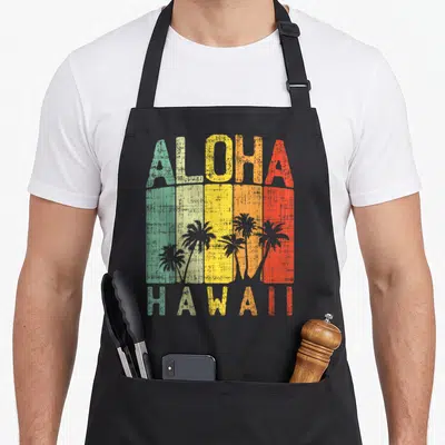 Tablier de cuisine noir avec inscription Aloha Hawaii et silhouettes de palmiers sur bandes colorées délavées