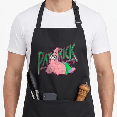 Tablier de cuisine noir avec illustration vintage de Patrick Star souriant et texte vert rose