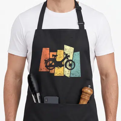 Tablier de cuisine noir avec silhouette de mobylette sur bandes orange jaune et turquoise texturées