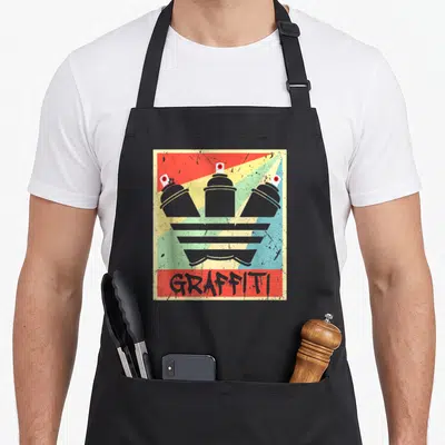 Tablier de cuisine noir avec illustration d'aérosols gris et texte GRAFFITI sur fond rayé coloré