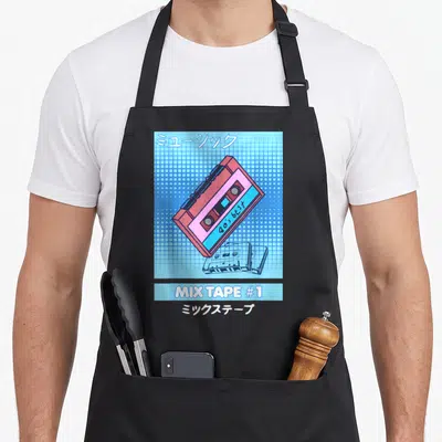 Tablier de cuisine noir avec illustration de cassette rose sur fond quadrillé bleu et texte Mix Tape #1