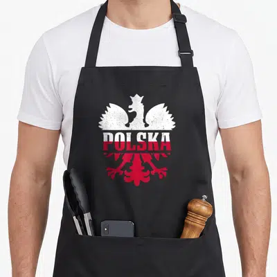 Tablier de cuisine noir avec un aigle blanc et rouge et l'inscription POLSKA en lettres capitales délavées.