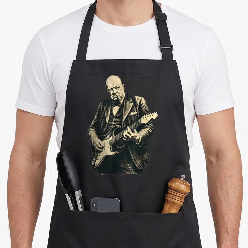 Tablier de cuisine noir avec illustration vintage de Winston Churchill jouant de la guitare électrique.
