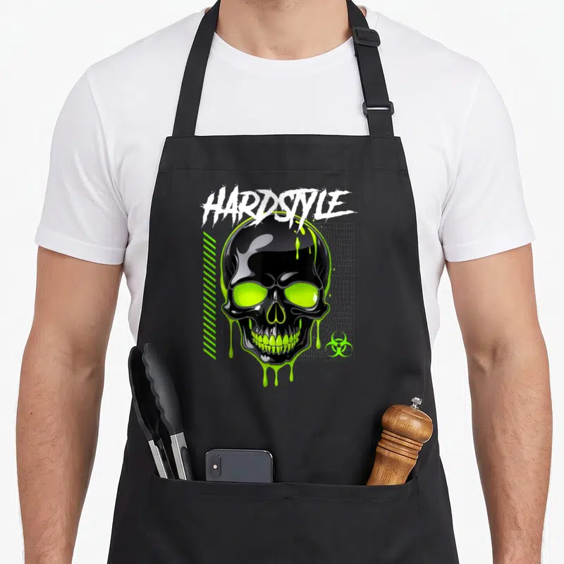 Tablier de cuisine noir avec crâne vert fluo, texte Hardstyle et symboles rétro.