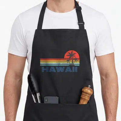 Tablier de cuisine noir avec illustration Hawaii palmiers et soleil couchant style rétro