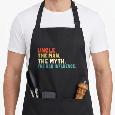 Tablier de cuisine noir avec inscription rétro multicolore UNCLE THE MAN THE MYTH THE BAD INFLUENCE.