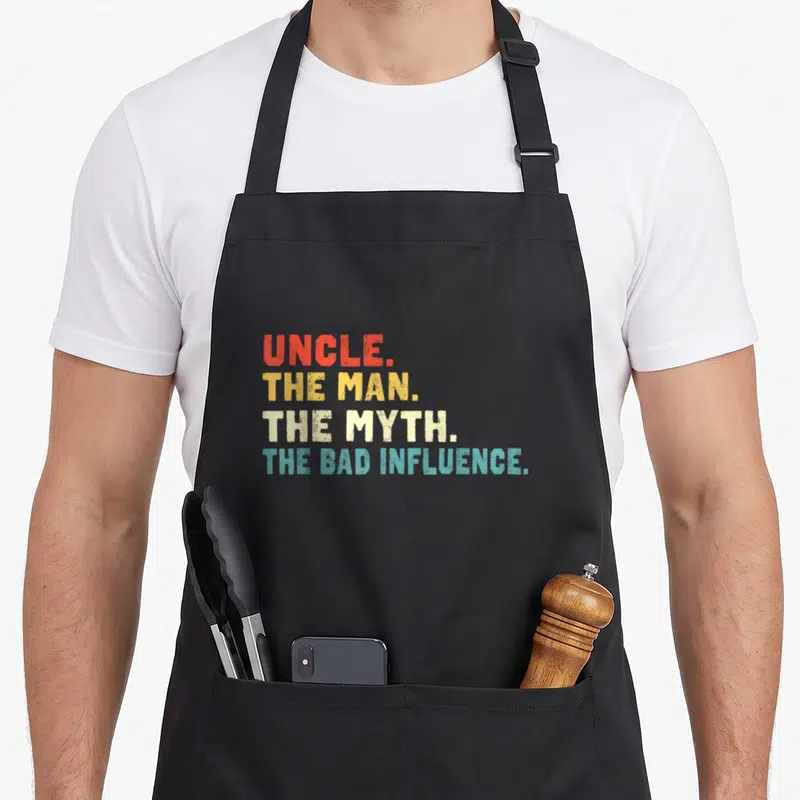 Tablier de cuisine noir avec inscription rétro multicolore UNCLE THE MAN THE MYTH THE BAD INFLUENCE.