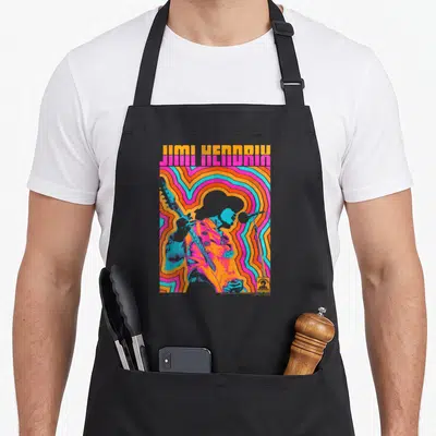 Tablier de cuisine noir avec silhouette de Jimi Hendrix et lignes ondulées colorées style rétro.