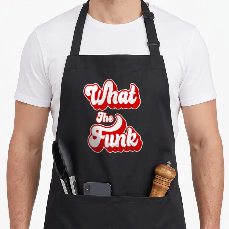 Tablier de cuisine noir avec typographie rouge et blanche What The Funk style rétro des années 70
