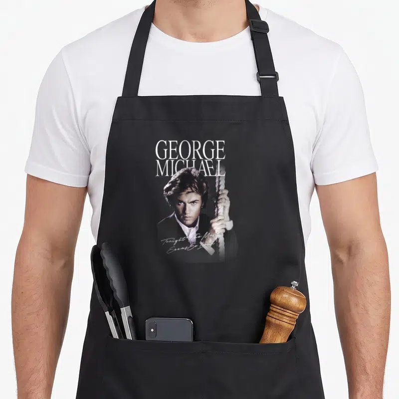 Tablier de cuisine noir avec portrait de George Michael tenant une corde et texte blanc.