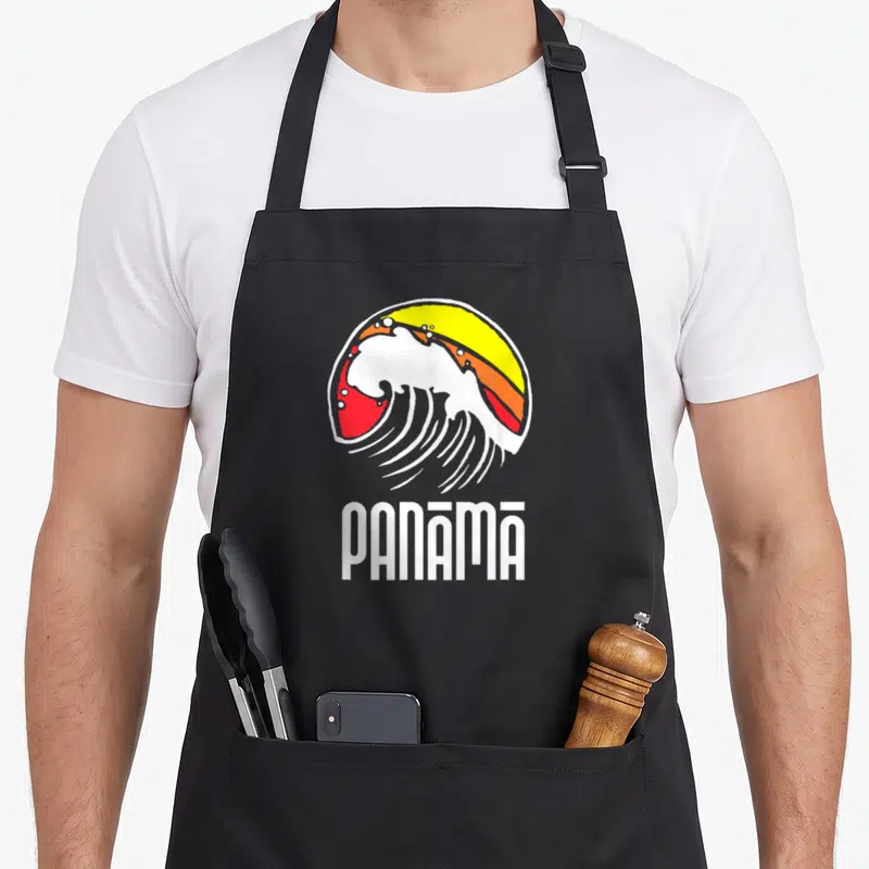 Tablier de cuisine noir avec illustration d'une onde blanche et du mot Panama en lettres blanches stylisées.
