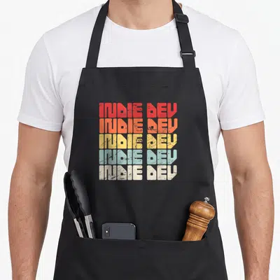 Tablier de cuisine noir avec inscription indie dev répétée en cinq couleurs dégradées style rétro égréné