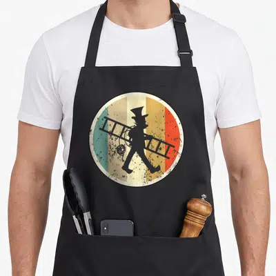 Tablier de cuisine noir avec illustration circulaire d'un ramoneur rétro portant une échelle sur fond de bandes colorées