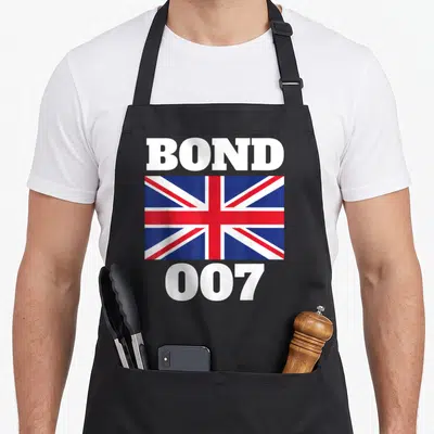 Tablier de cuisine noir avec l'inscription Bond 007 et le drapeau britannique au centre.