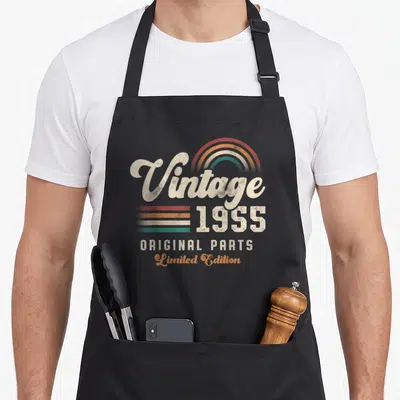 Tablier de cuisine noir avec inscription Vintage 1955 Original Parts Limited Edition et arc-en-ciel coloré.