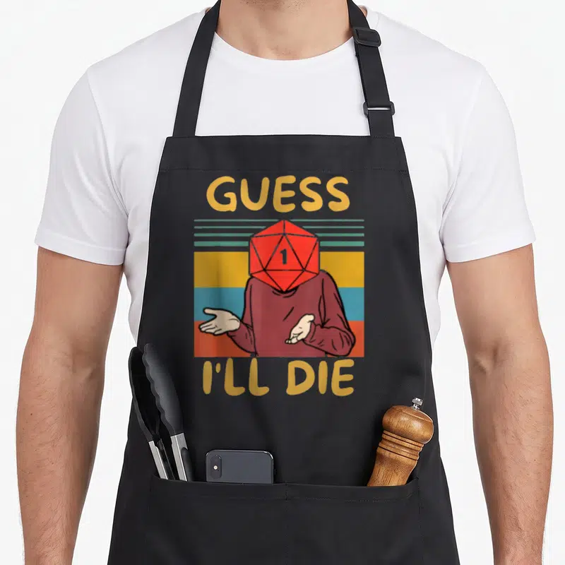 Tablier de cuisine noir avec illustrationGuess I'll Die et dé rouge sur fond rayé rétro.