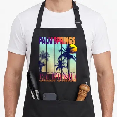 Tablier de cuisine noir avec illustration rétro Palm Springs California et palmiers au coucher de soleil
