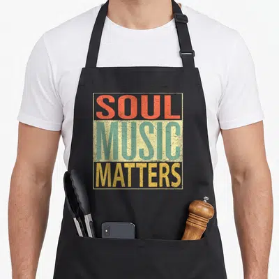 Tablier de cuisine noir avec inscription Soul Music Matters en lettres orange vert et jaune style années 70